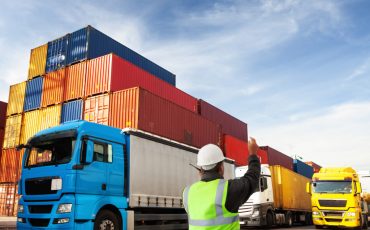 container terminal with trucks with freight forwarding manager,worker cu of person working, low angle,